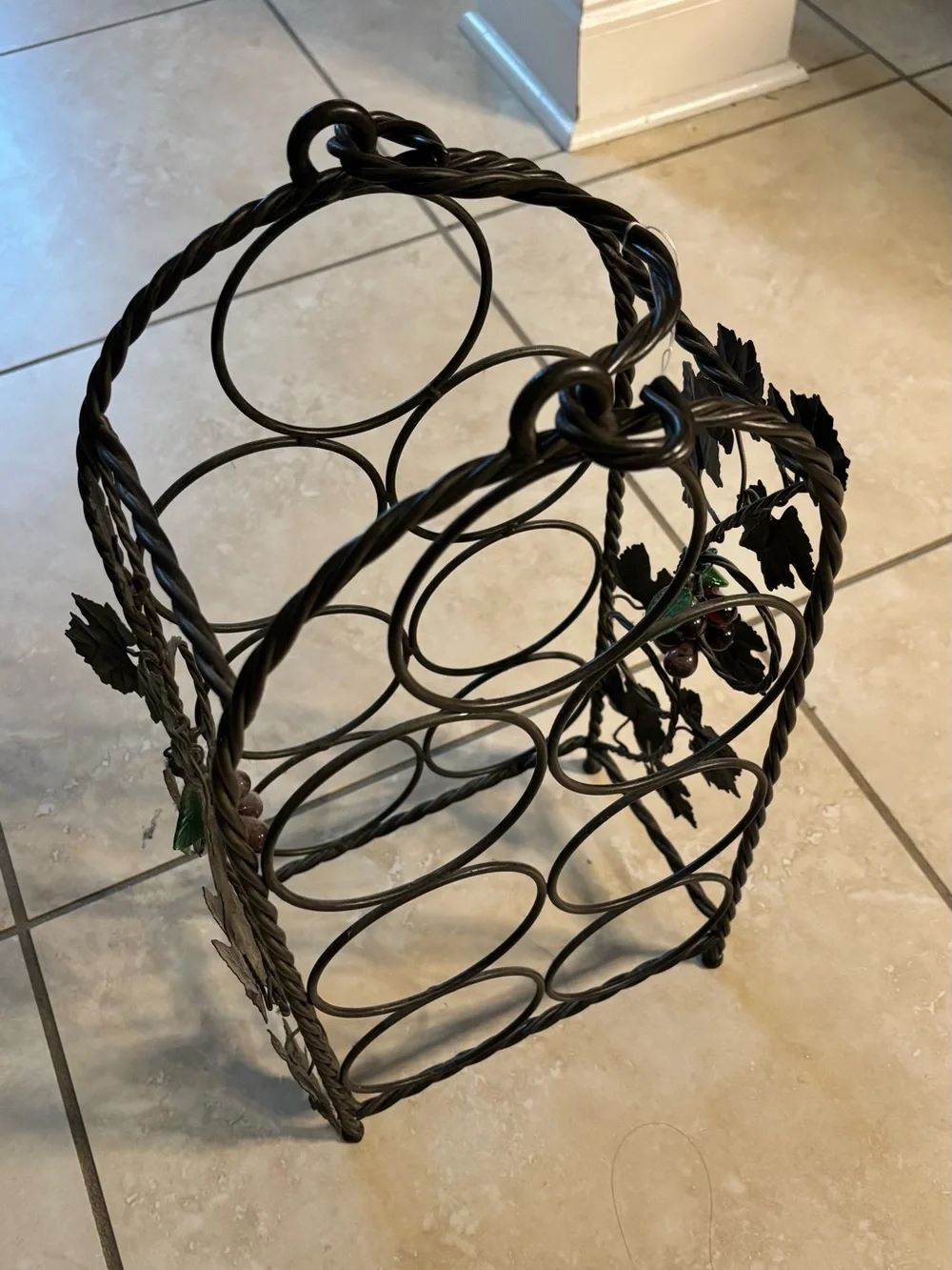 Black Metal Wine Bottle Rack with Decorative Leaf Accents